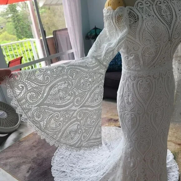 Mermaid wedding dress with bell sleeves and crochet lace off the Shoulder