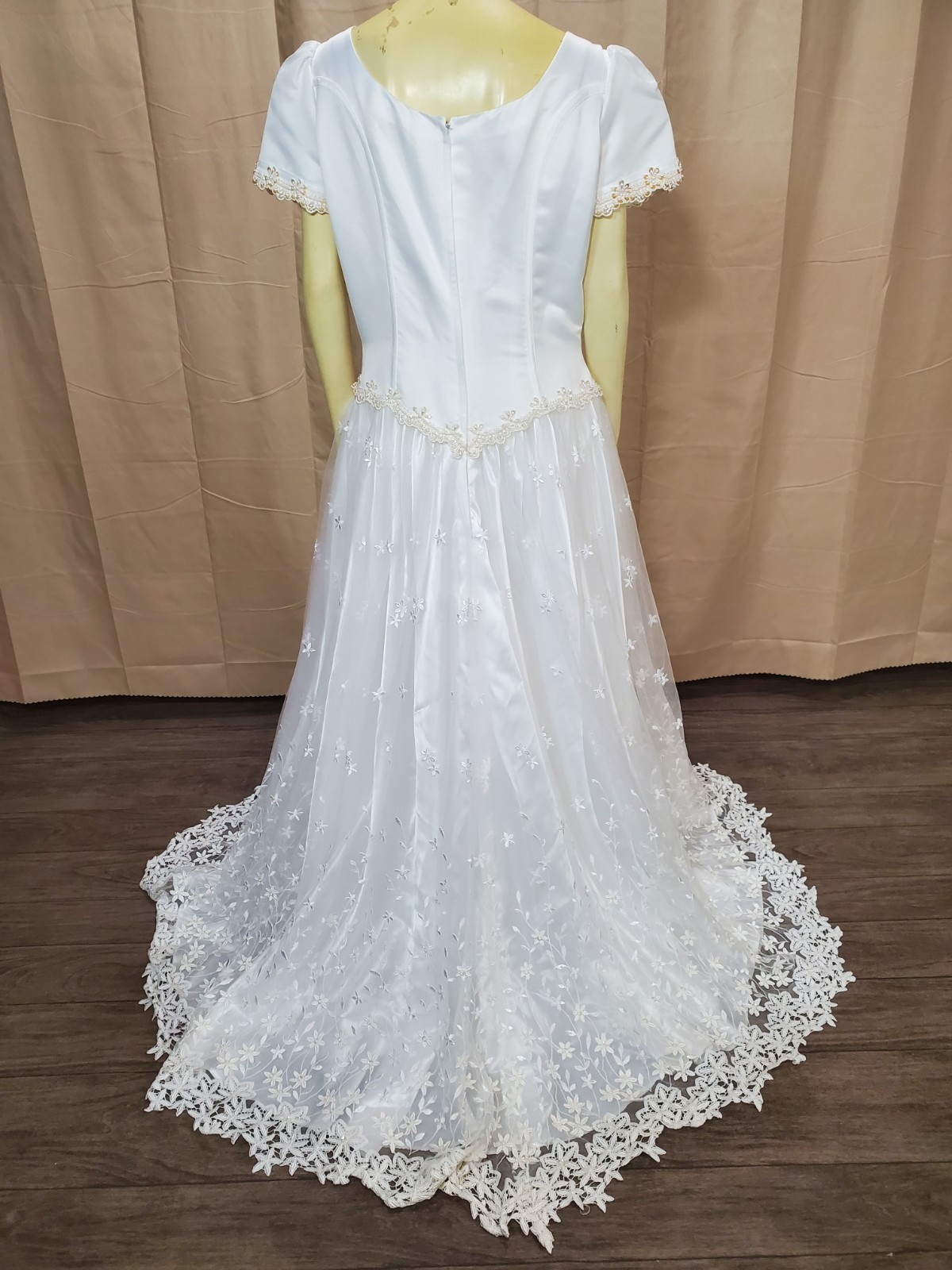 Mary’s bridal Floral lace applique on skirt and hem timeless silhouette.