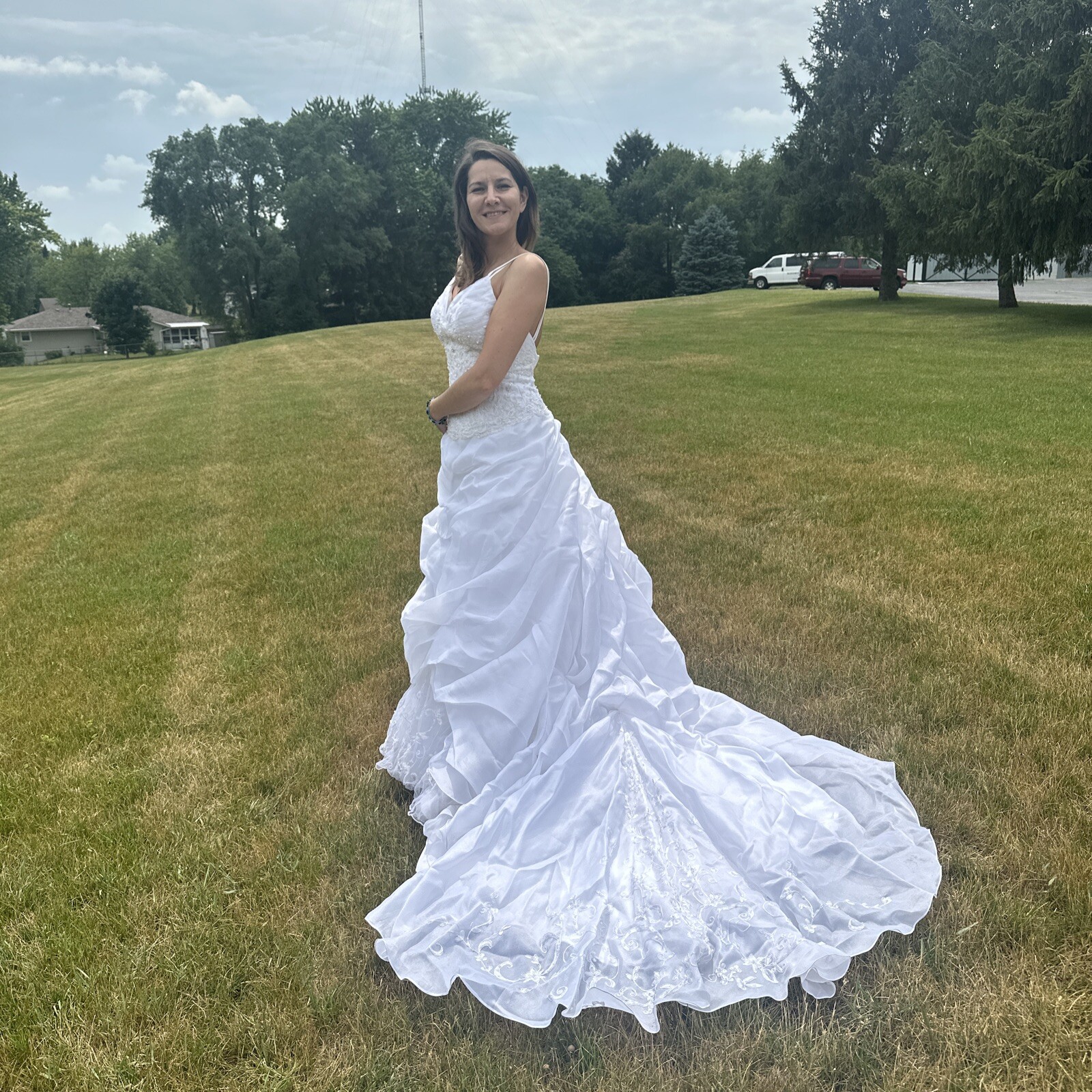 La Sposa Wedding Dress, gently used, size US 04 with a long beautiful train.