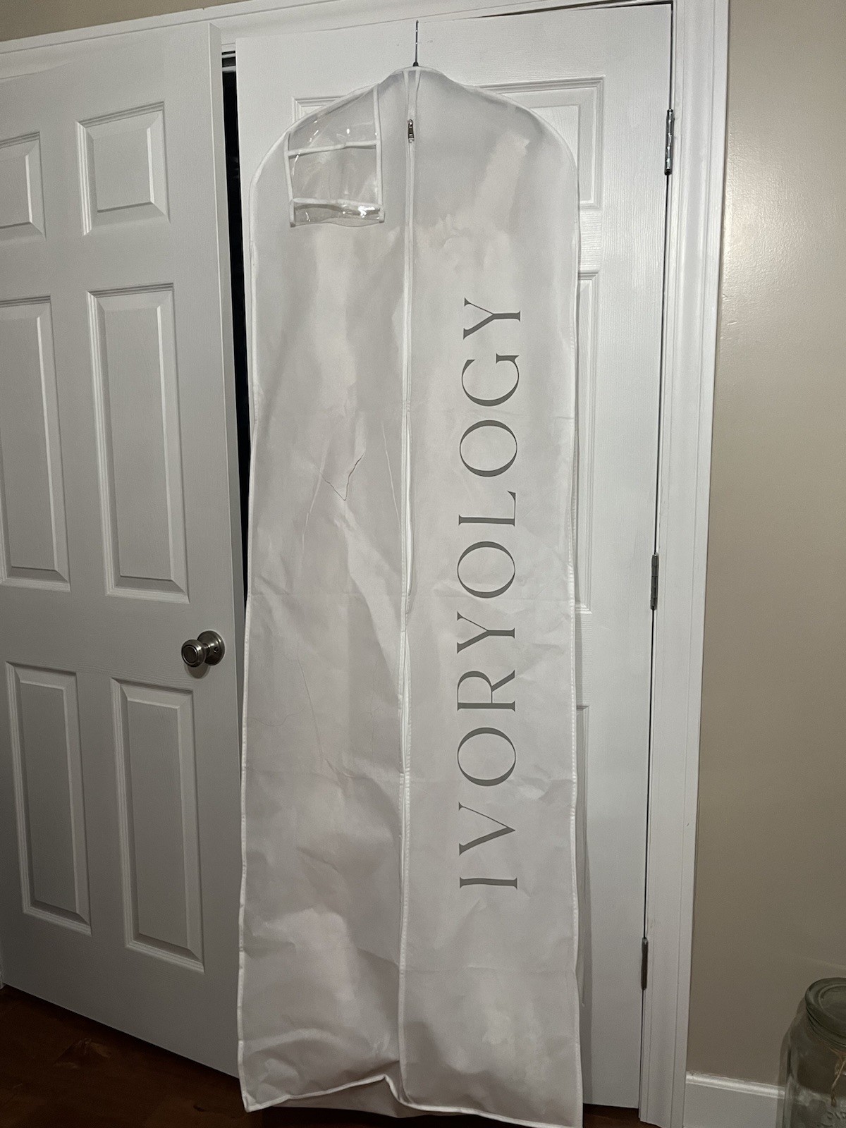 A contemporary white lace and tulle wedding dress with V-neck. Brand New Size 12