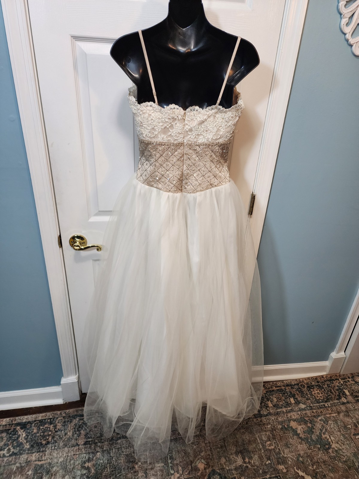 White tulle and lace gown with a gold beaded bodice David’s Bridal Size 8