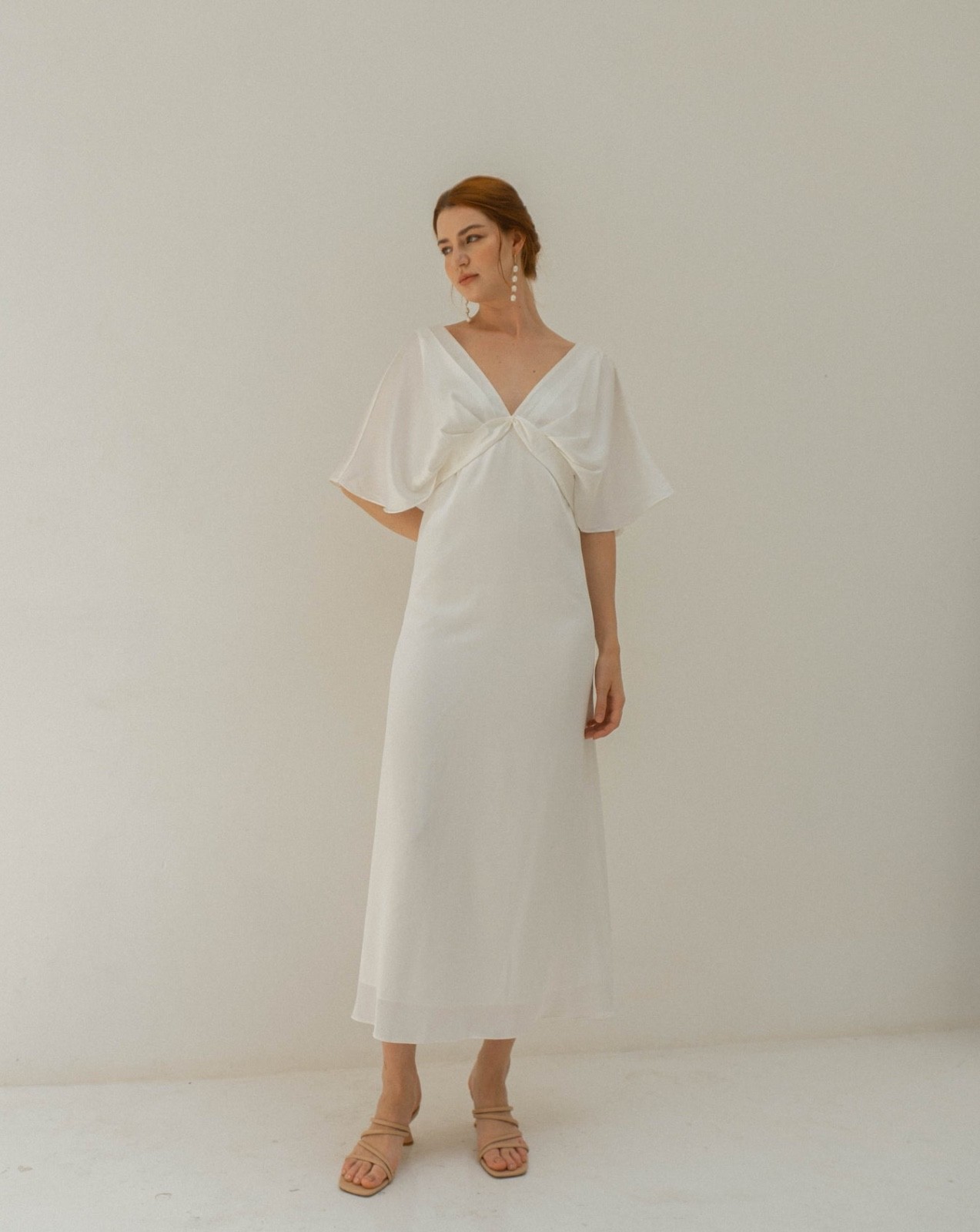 Wedding dress, size M. White satin fabric. Tea length brand new open back style