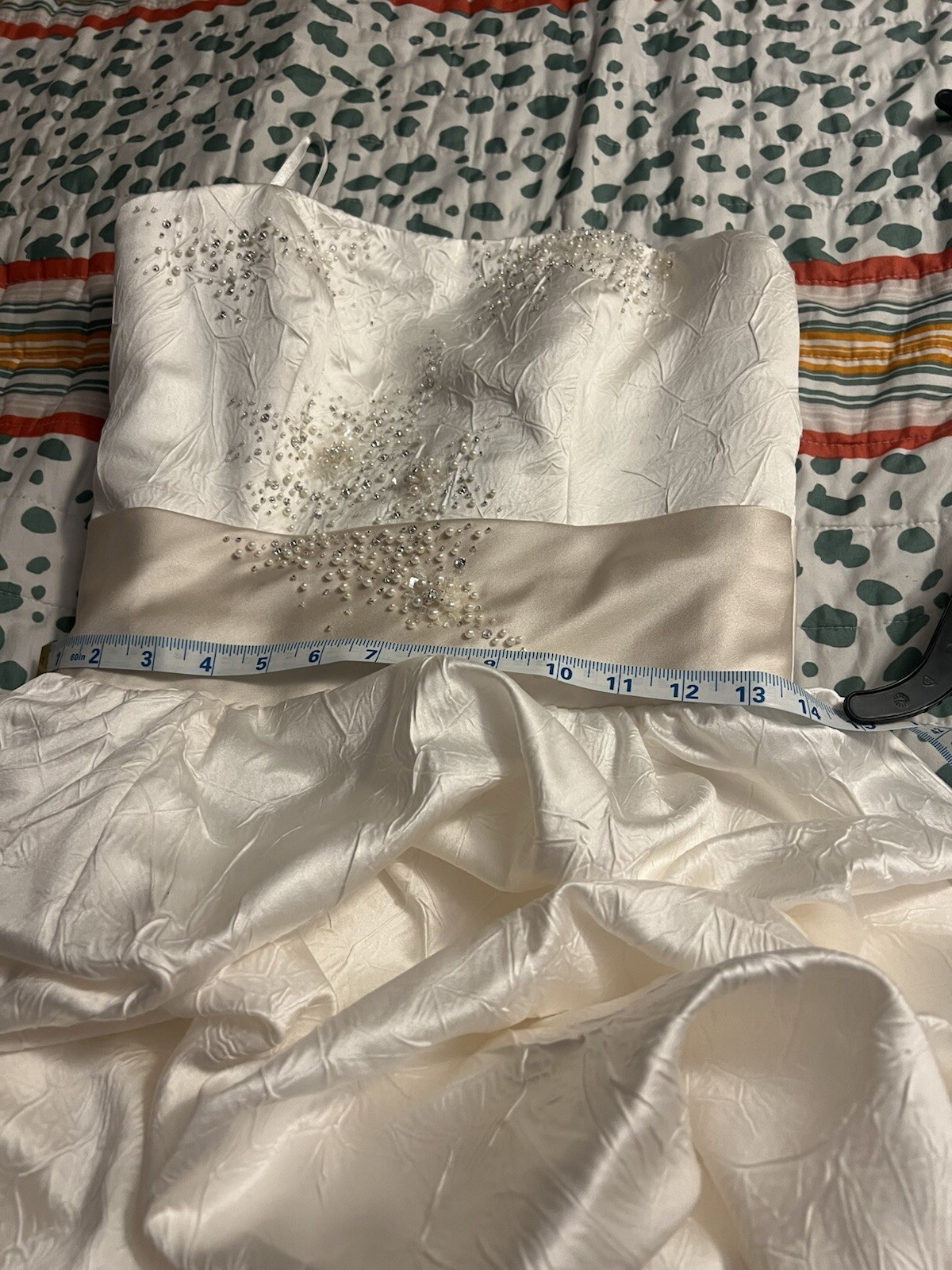 Enzoani wedding dress is a size small is off-white and beige is very beautiful