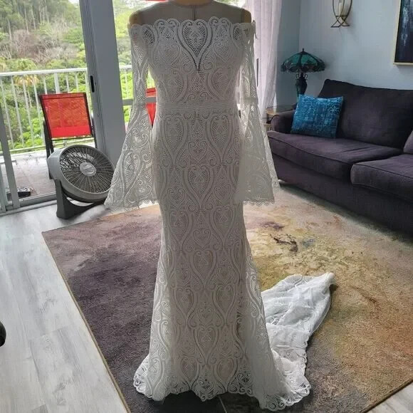 Mermaid wedding dress with bell sleeves and crochet lace off the Shoulder