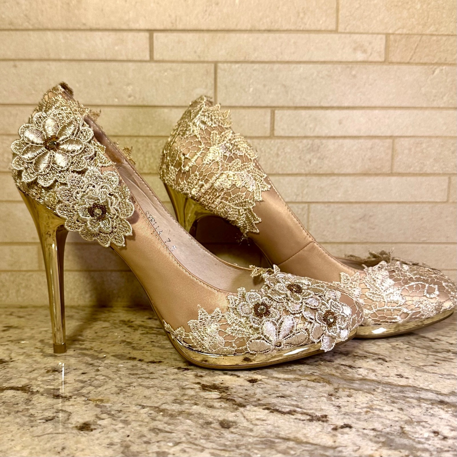Stella stilettos, pumps by Bella Belle, women’s size 7 1/2. In floral champagne