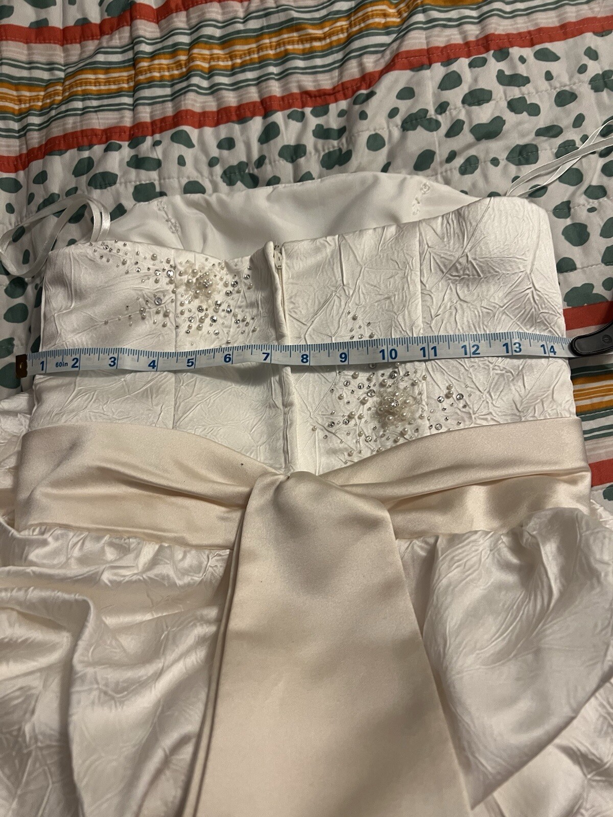 Enzoani wedding dress is a size small is off-white and beige is very beautiful