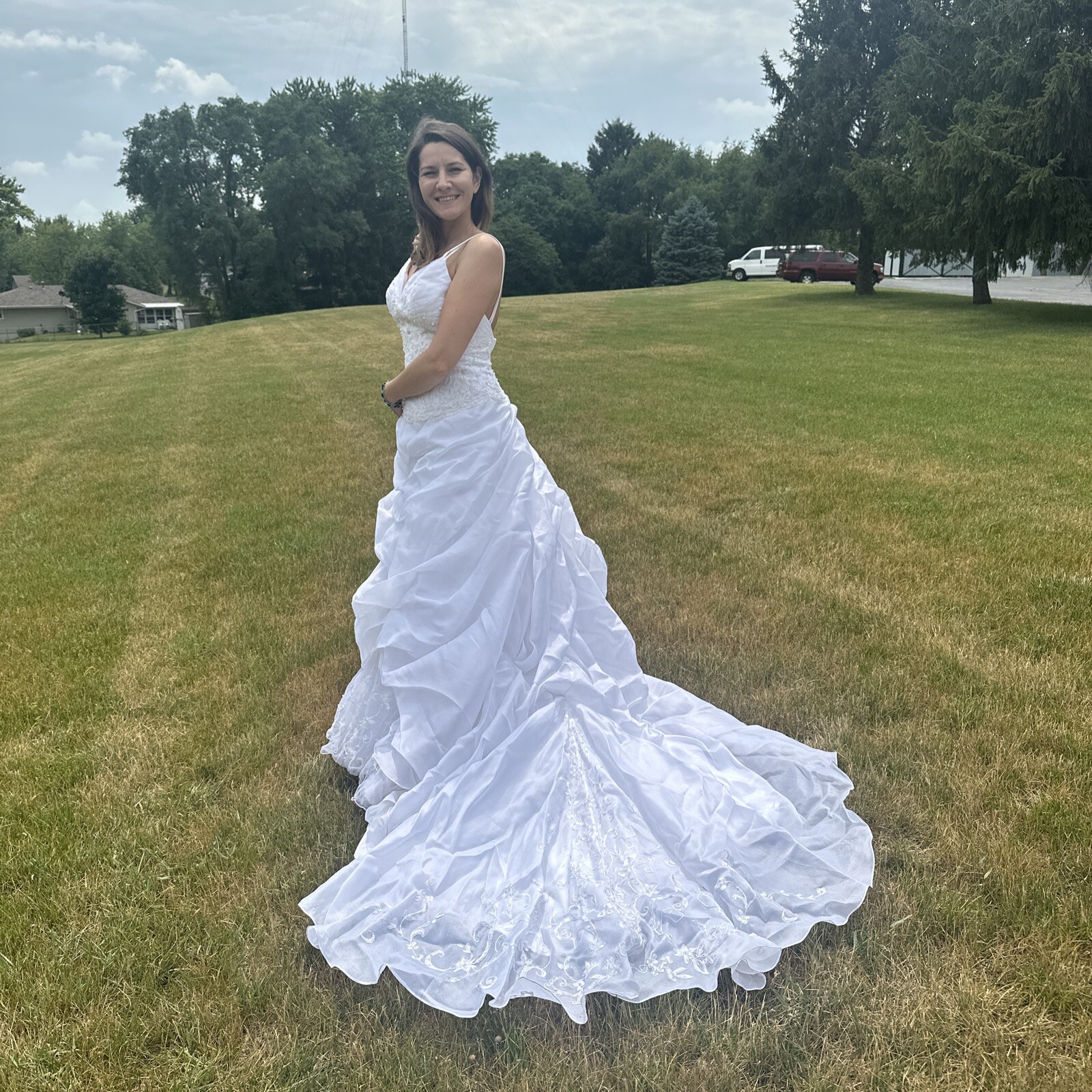 La Sposa Wedding Dress, gently used, size US 04 with a long beautiful train.