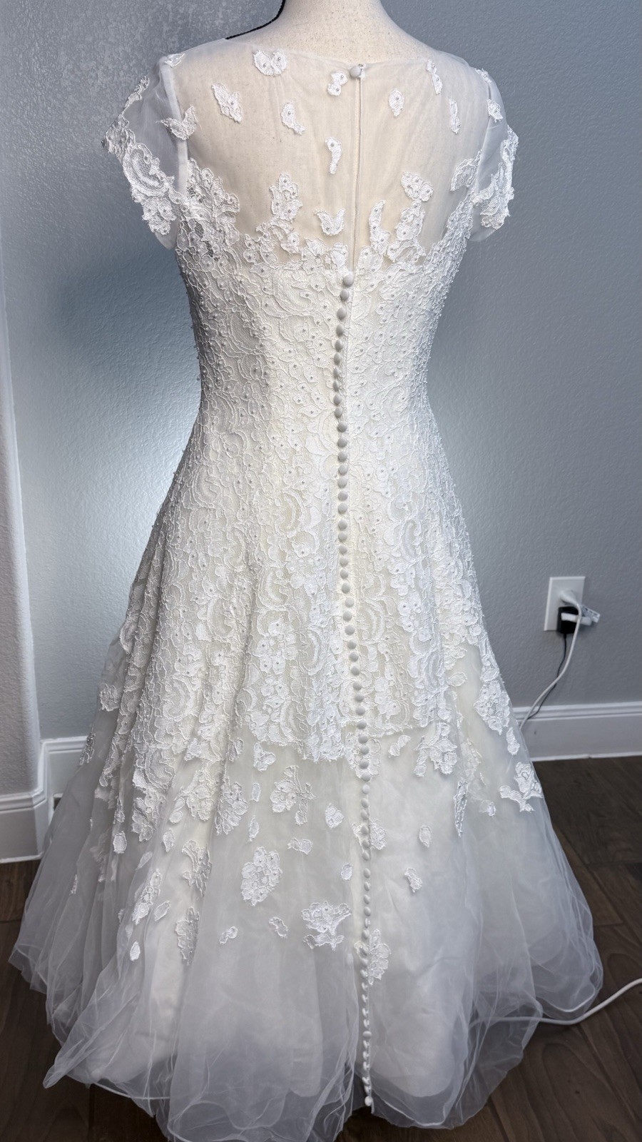 White tea length, size 10 wedding dress by Oleg Cassini