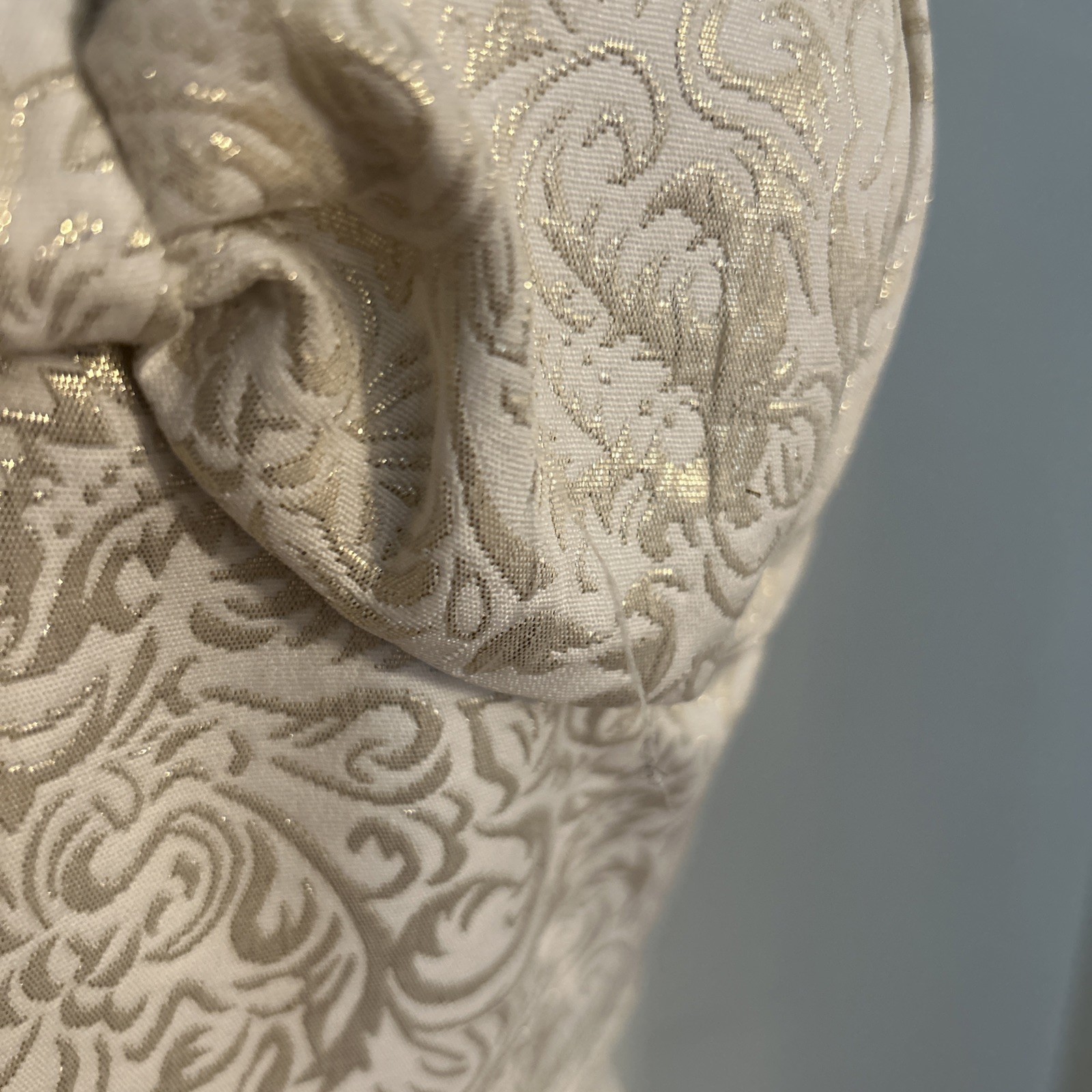Vintage-style, tea-length halter wedding dress in champagne brocade.