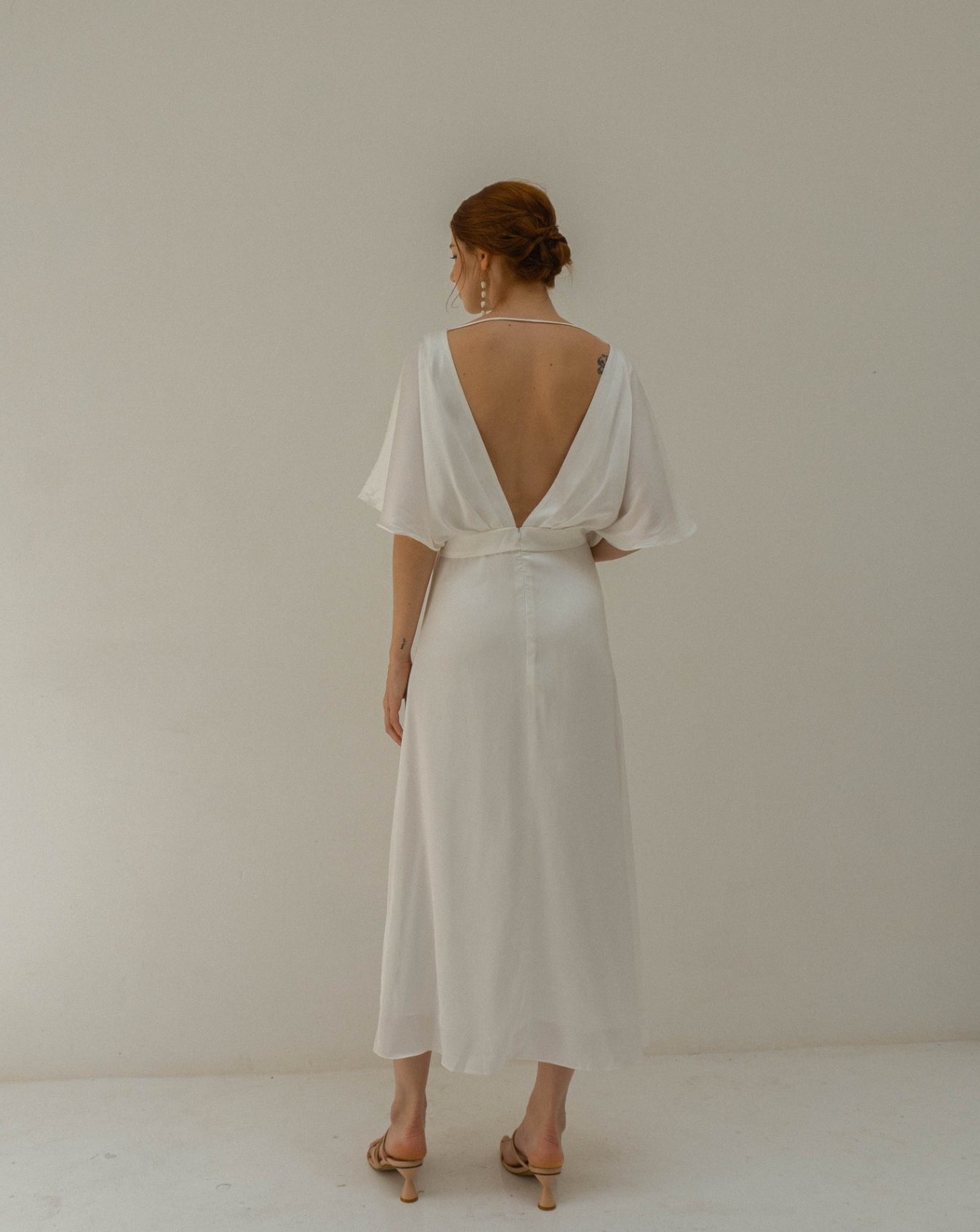 Wedding dress, size M. White satin fabric. Tea length brand new open back style
