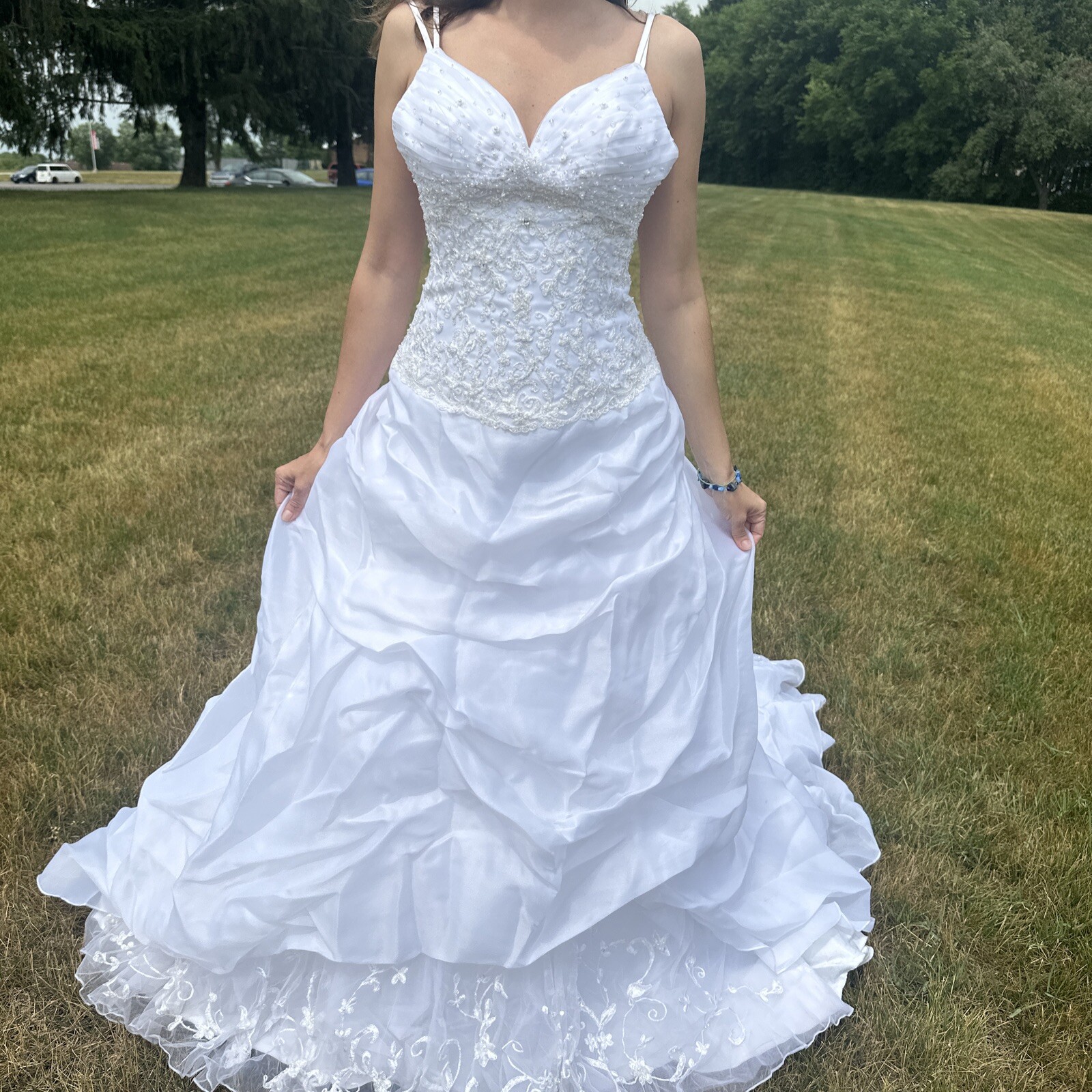 La Sposa Wedding Dress, gently used, size US 04 with a long beautiful train.