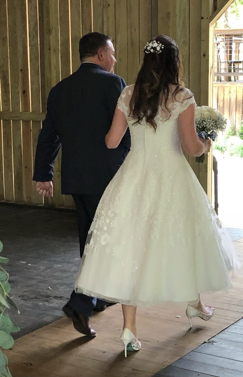 White tea length, size 10 wedding dress by Oleg Cassini
