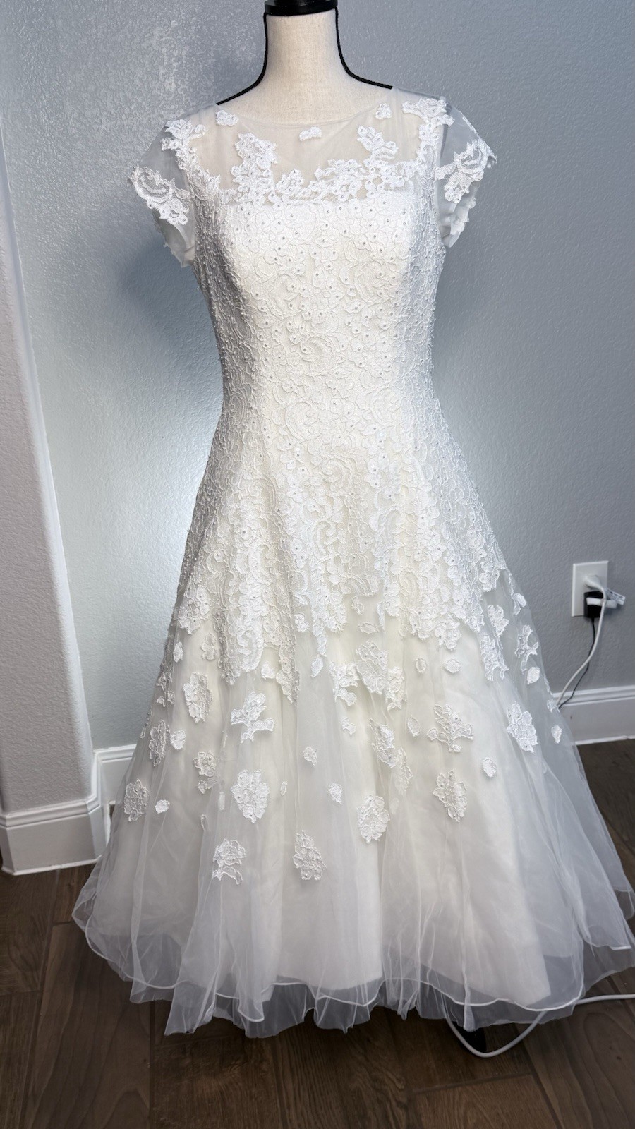 White tea length, size 10 wedding dress by Oleg Cassini