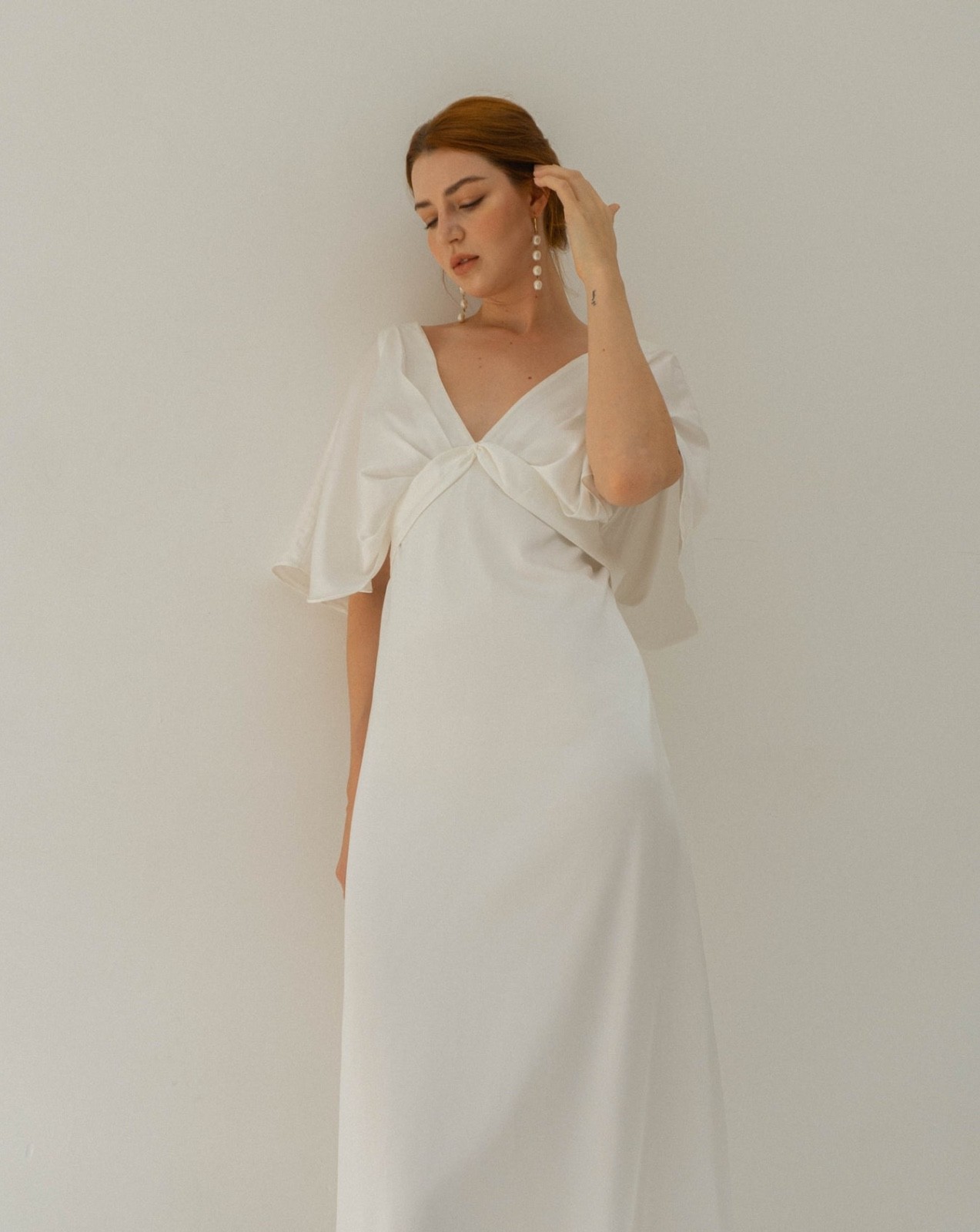 Wedding dress, size M. White satin fabric. Tea length brand new open back style