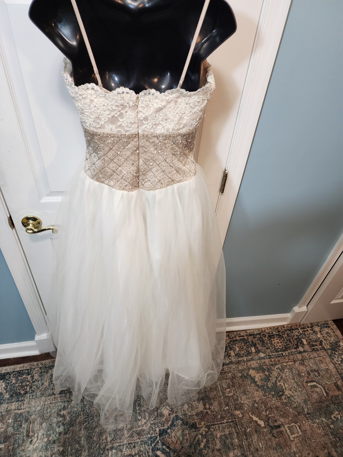 White tulle and lace gown with a gold beaded bodice David’s Bridal Size 8
