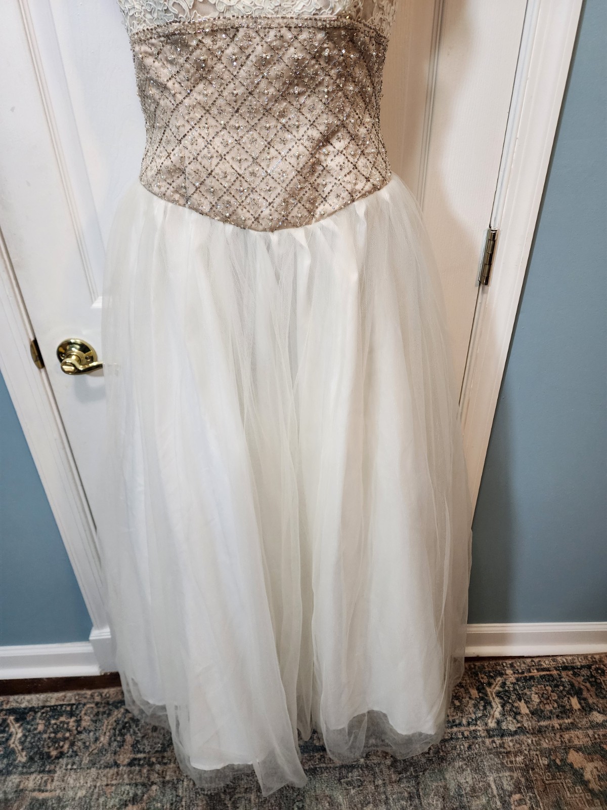 White tulle and lace gown with a gold beaded bodice David’s Bridal Size 8