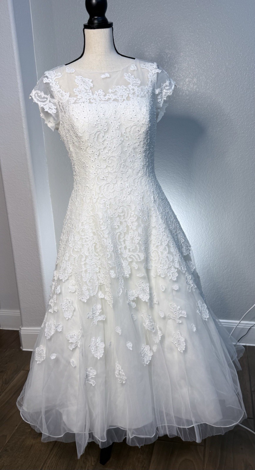 White tea length, size 10 wedding dress by Oleg Cassini