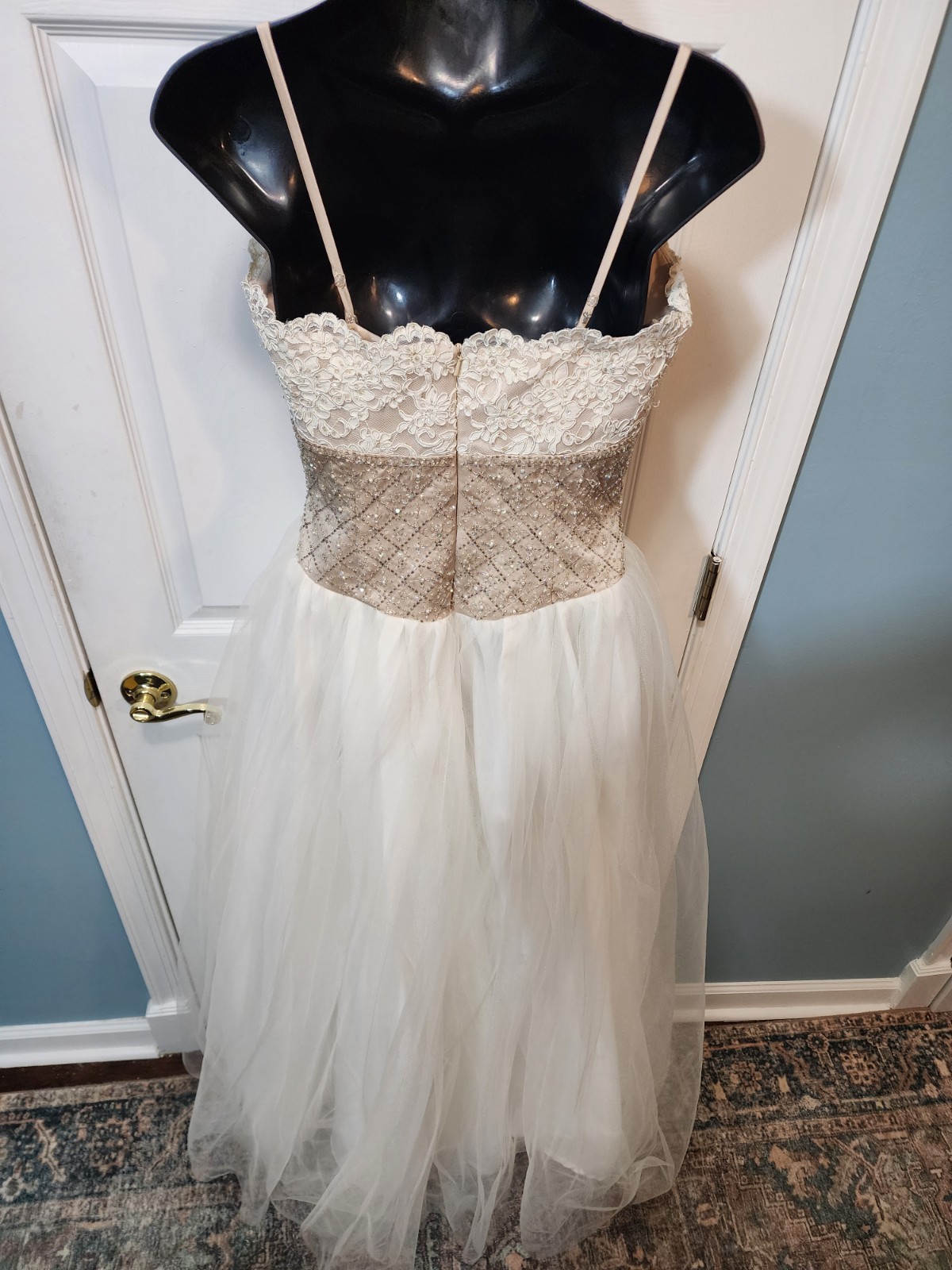 White tulle and lace gown with a gold beaded bodice David’s Bridal Size 8