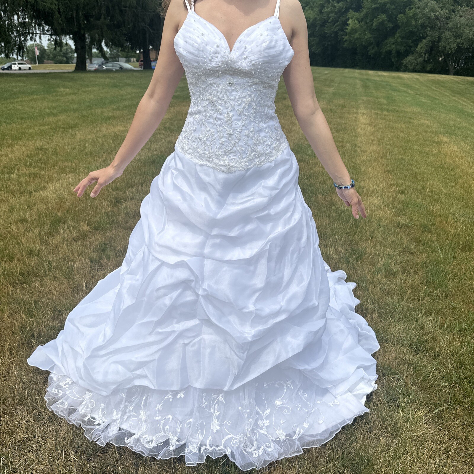 La Sposa Wedding Dress, gently used, size US 04 with a long beautiful train.