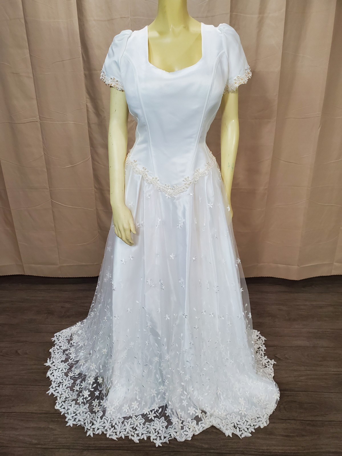 Mary’s bridal Floral lace applique on skirt and hem timeless silhouette.