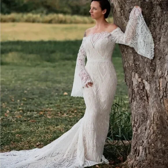 Mermaid wedding dress with bell sleeves and crochet lace off the Shoulder