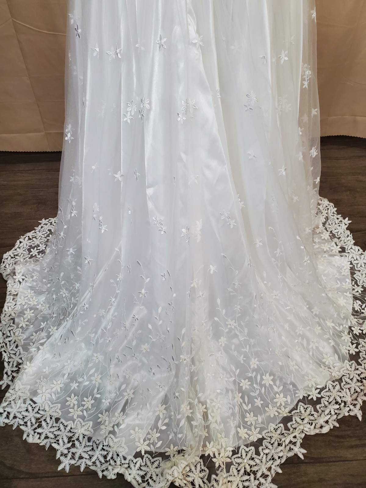 Mary’s bridal Floral lace applique on skirt and hem timeless silhouette.