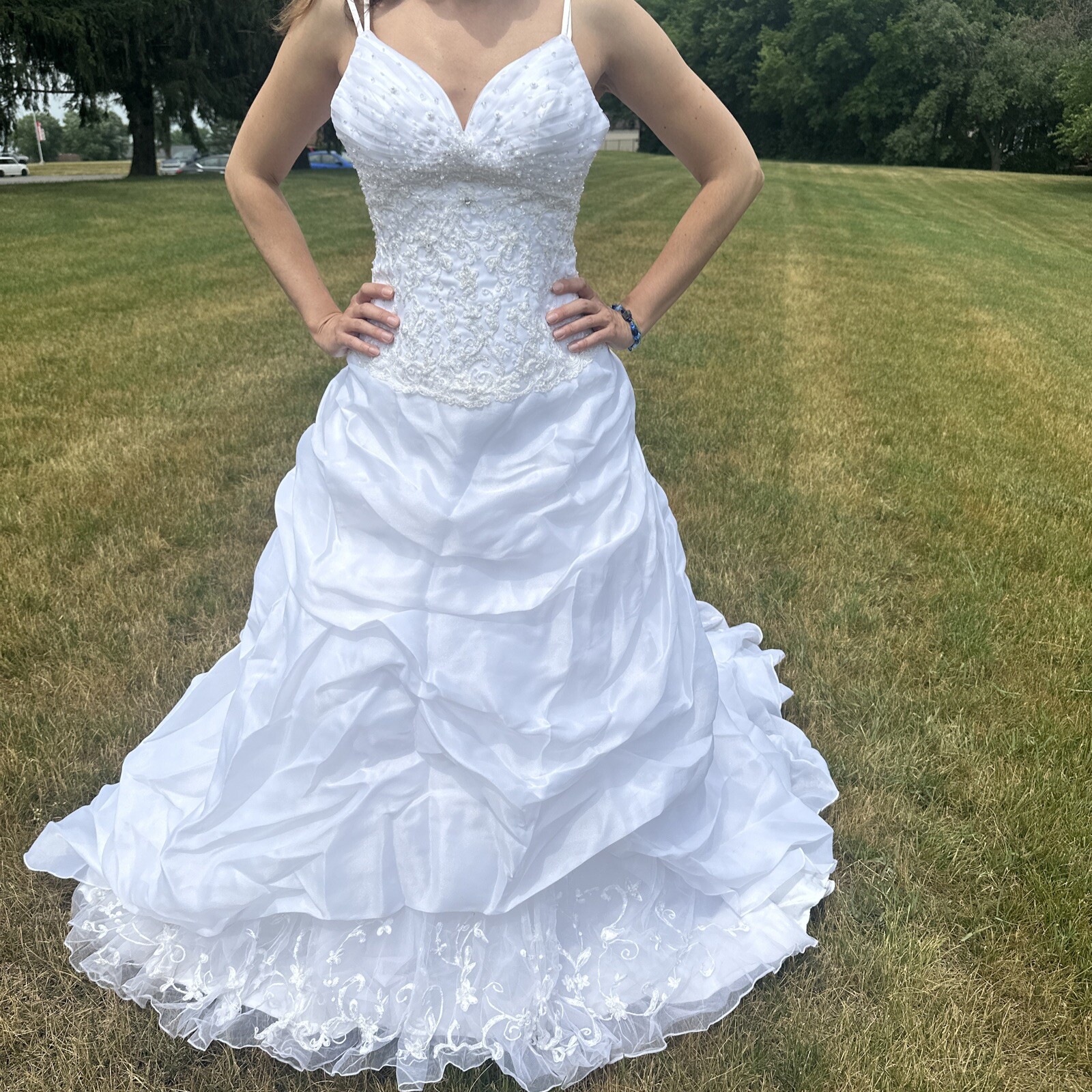 La Sposa Wedding Dress, gently used, size US 04 with a long beautiful train.
