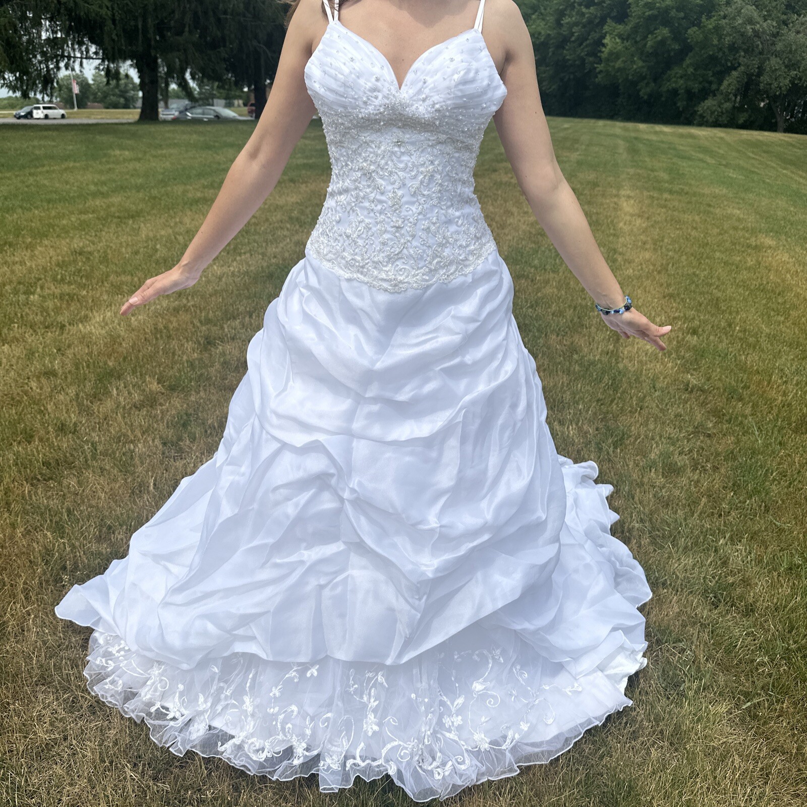 La Sposa Wedding Dress, gently used, size US 04 with a long beautiful train.