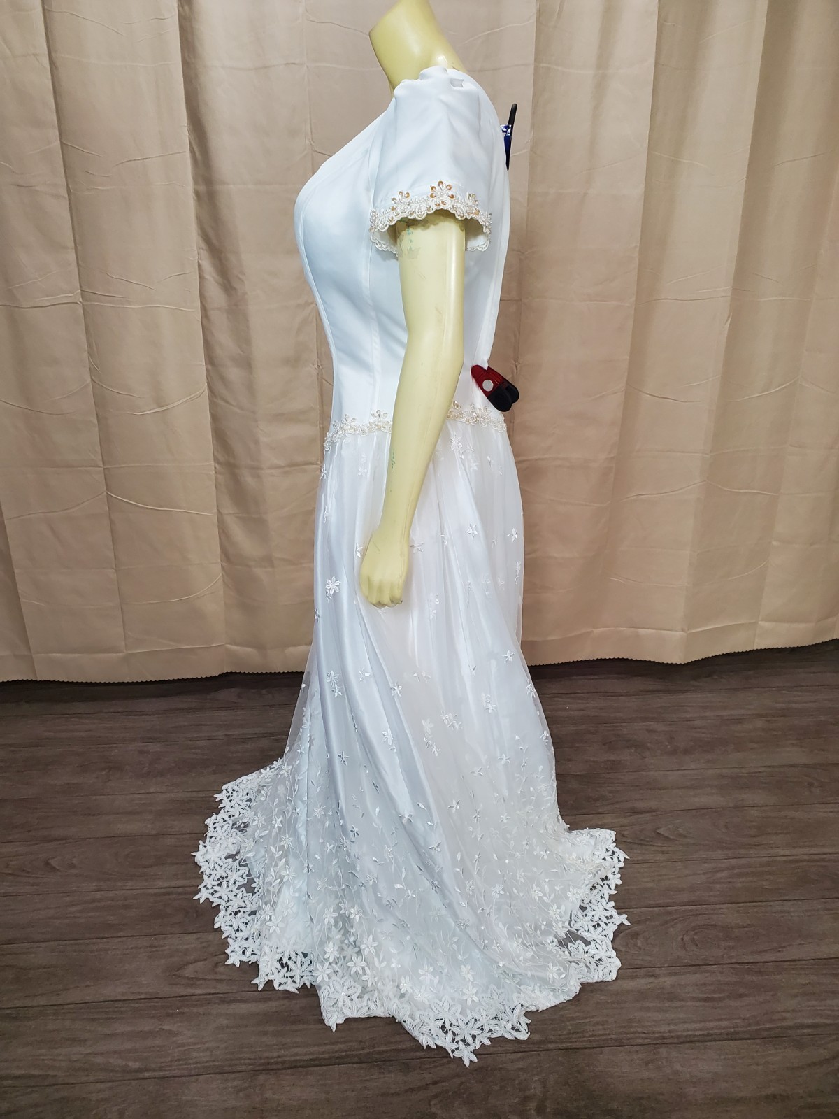 Mary’s bridal Floral lace applique on skirt and hem timeless silhouette.