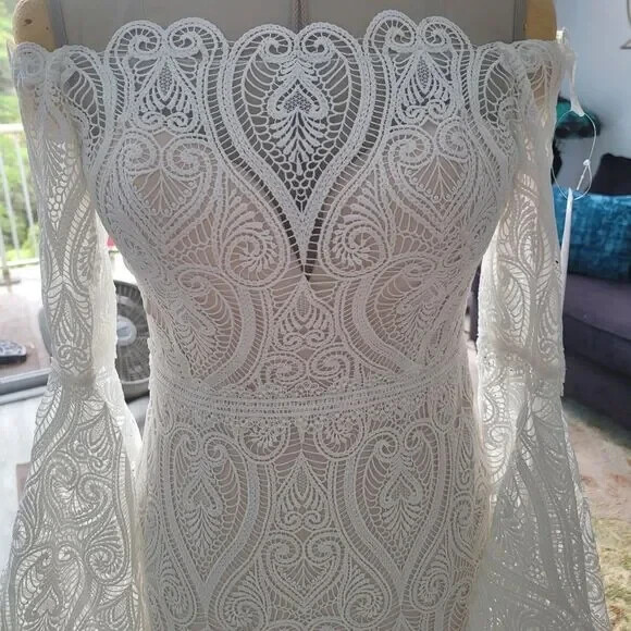Mermaid wedding dress with bell sleeves and crochet lace off the Shoulder