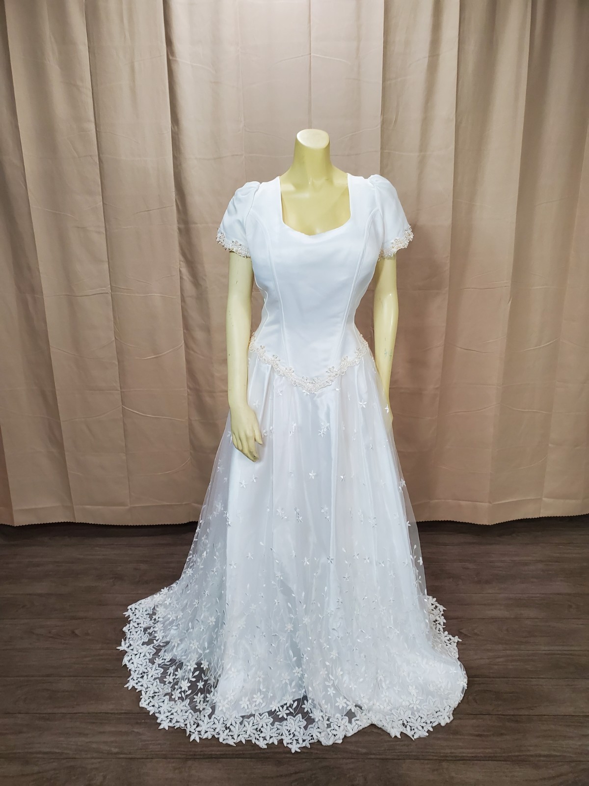Mary’s bridal Floral lace applique on skirt and hem timeless silhouette.