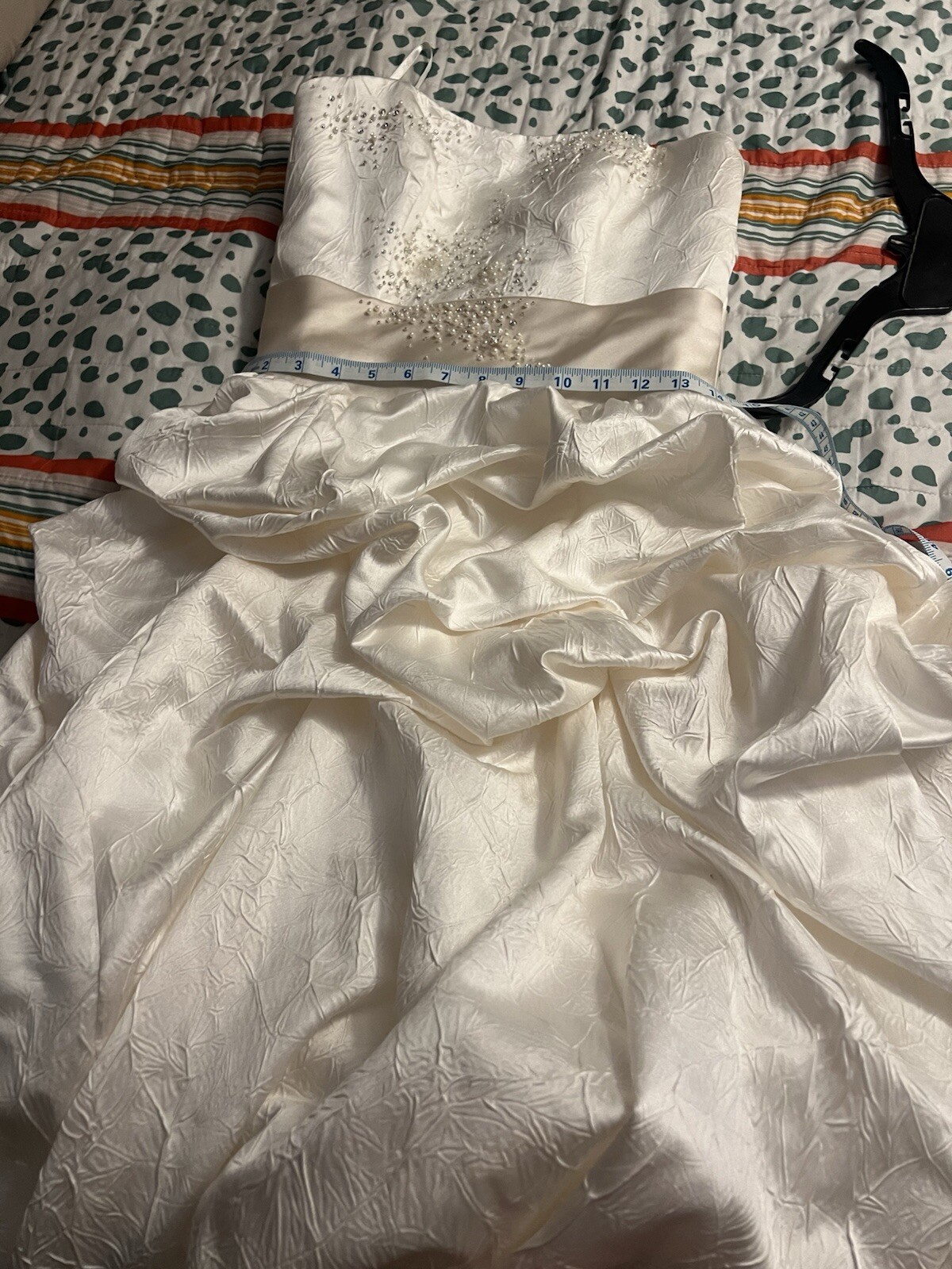 Enzoani wedding dress is a size small is off-white and beige is very beautiful