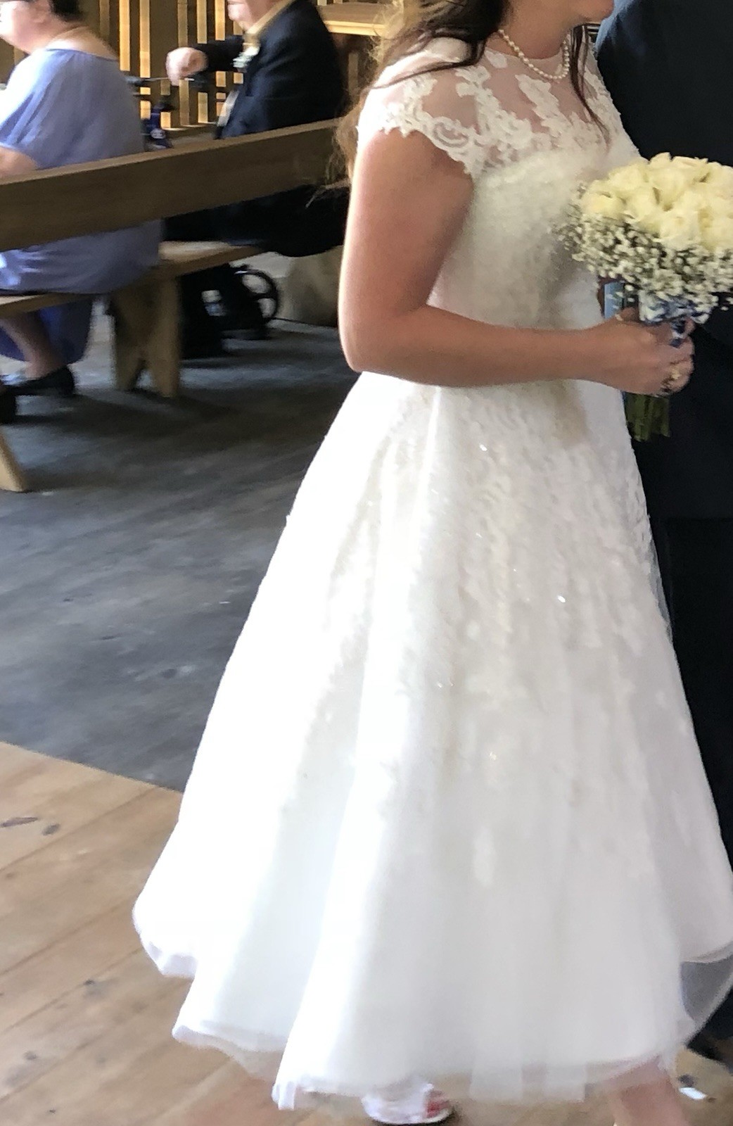 White tea length, size 10 wedding dress by Oleg Cassini