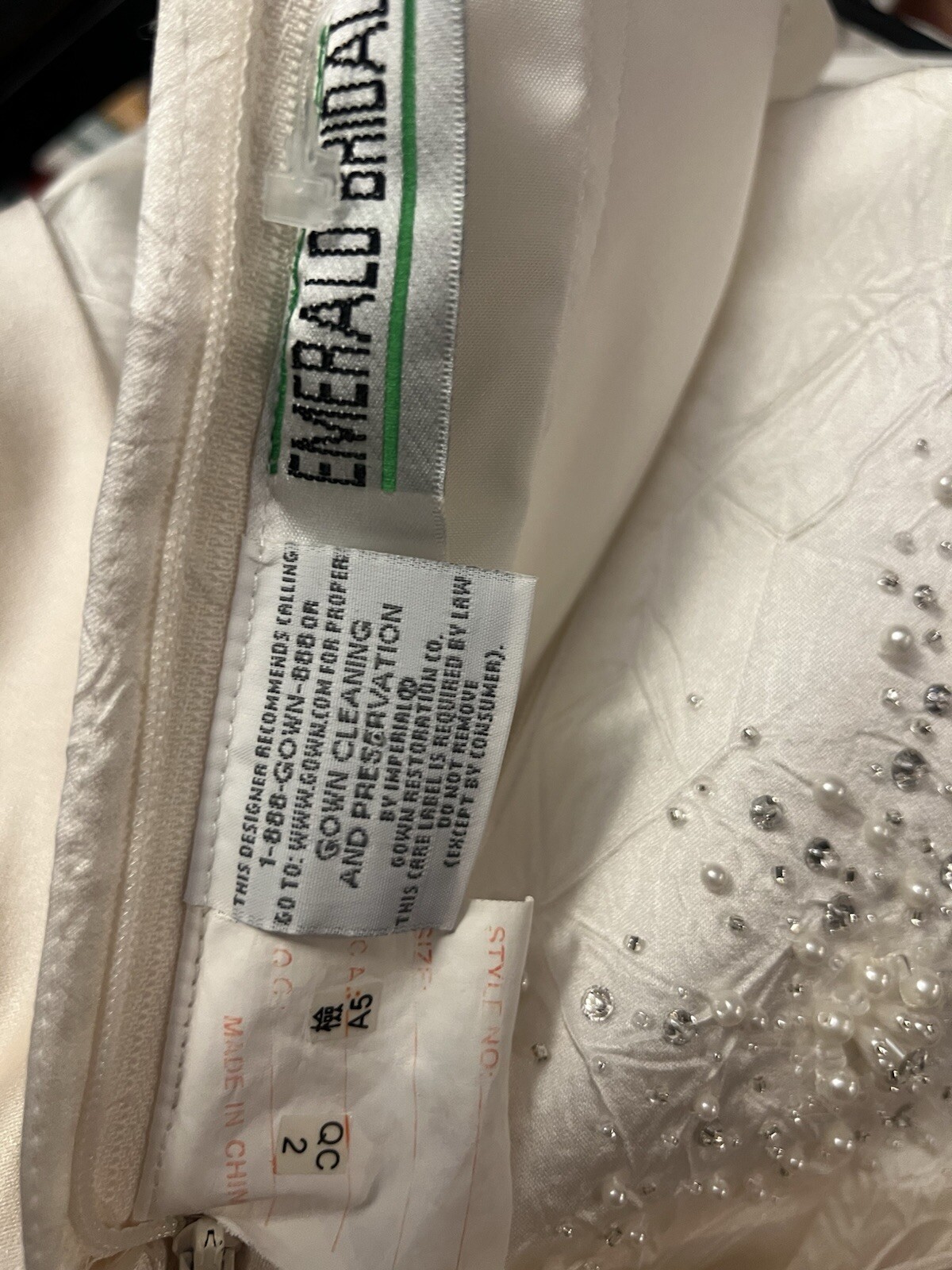 Enzoani wedding dress is a size small is off-white and beige is very beautiful