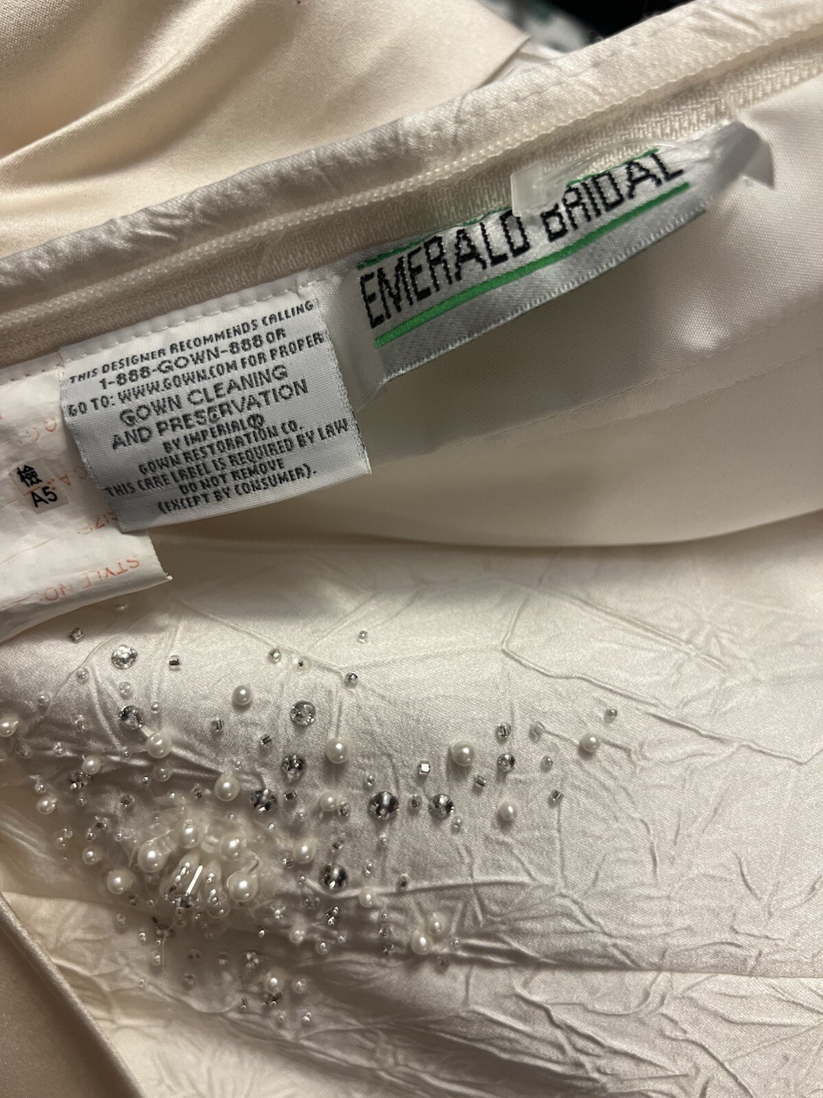 Enzoani wedding dress is a size small is off-white and beige is very beautiful