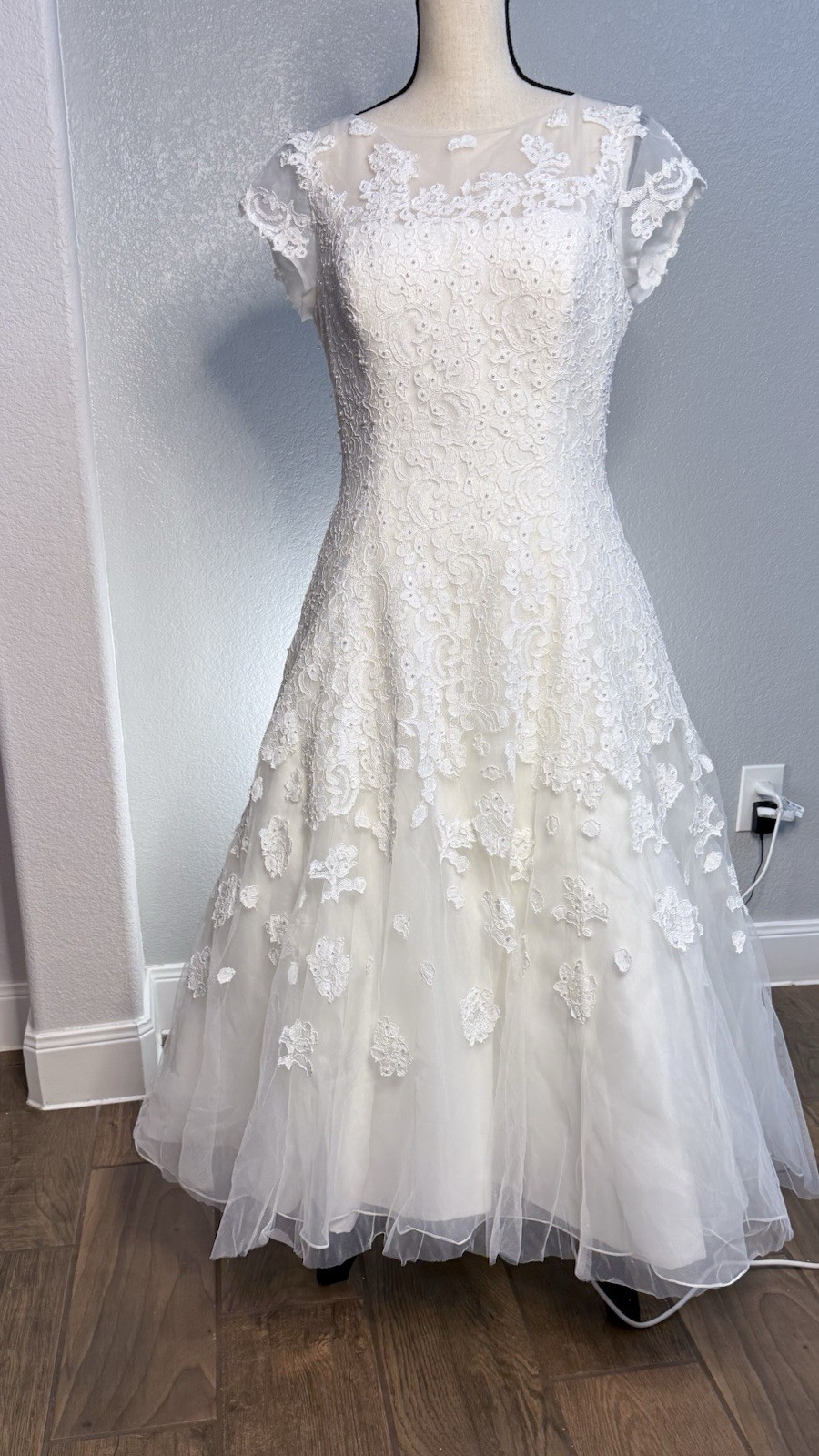 White tea length, size 10 wedding dress by Oleg Cassini