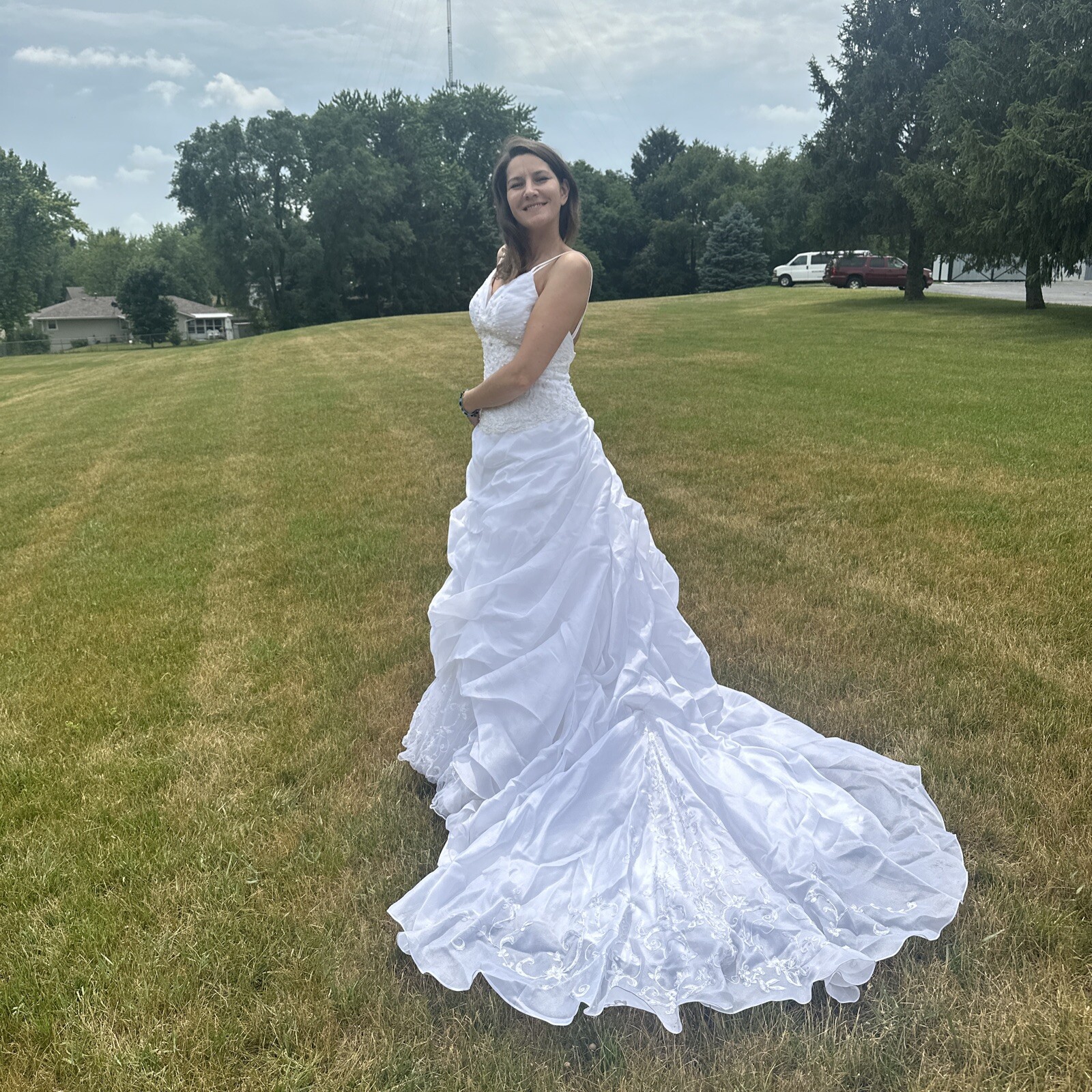 La Sposa Wedding Dress, gently used, size US 04 with a long beautiful train.