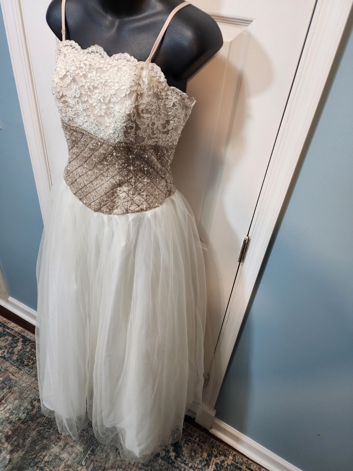 White tulle and lace gown with a gold beaded bodice David’s Bridal Size 8