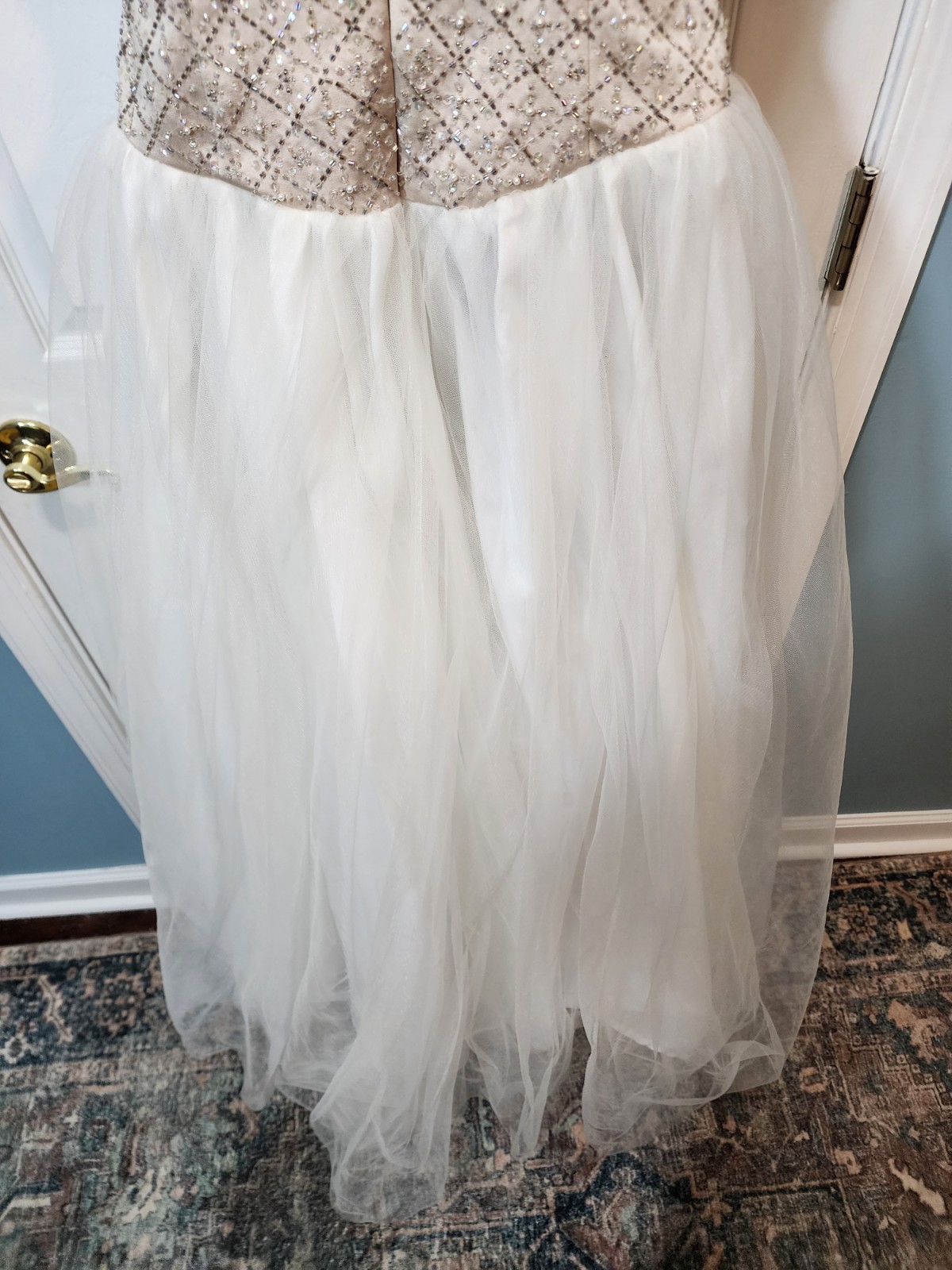 White tulle and lace gown with a gold beaded bodice David’s Bridal Size 8